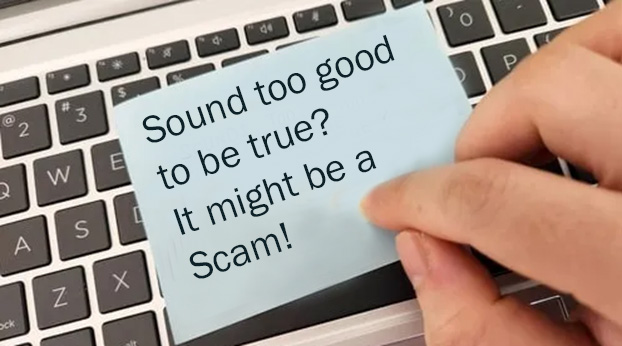 image of a keyboard with a sticky note that reads: Sounds too good to be true? It might be a Scam!